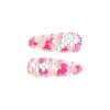 Twee roze haarclips Bowi van Souza! met glanzende pailletten, naast elkaar op een witte achtergrond