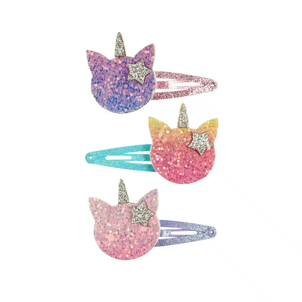 Drie pastelkleurige glitterhaarclips van Souza! in unicornvorm, met sterren en glinsterende hoorns.