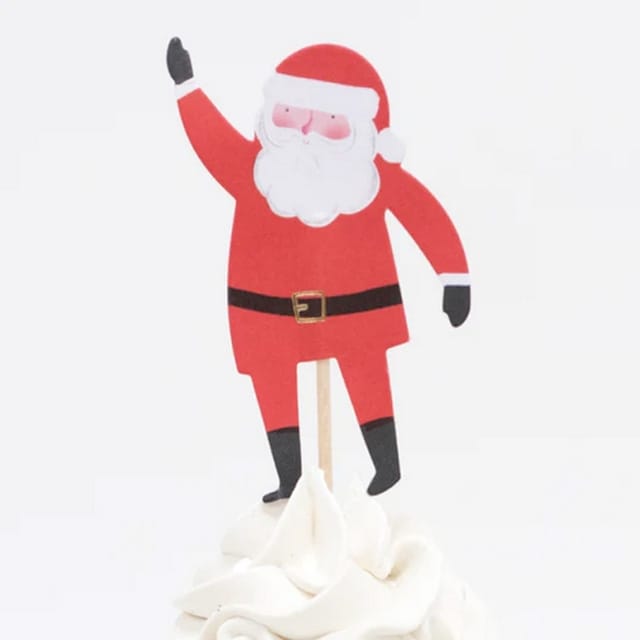Kerstmanprikker uit de cupcake set, geplaatst in een cupcake met witte frosting