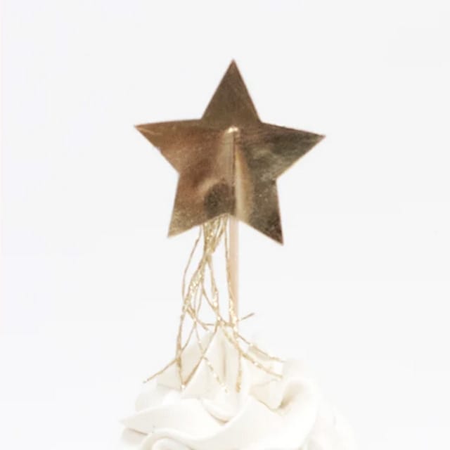 Gouden ster met franjes als versiering uit de cupcake set kerst van Meri Meri