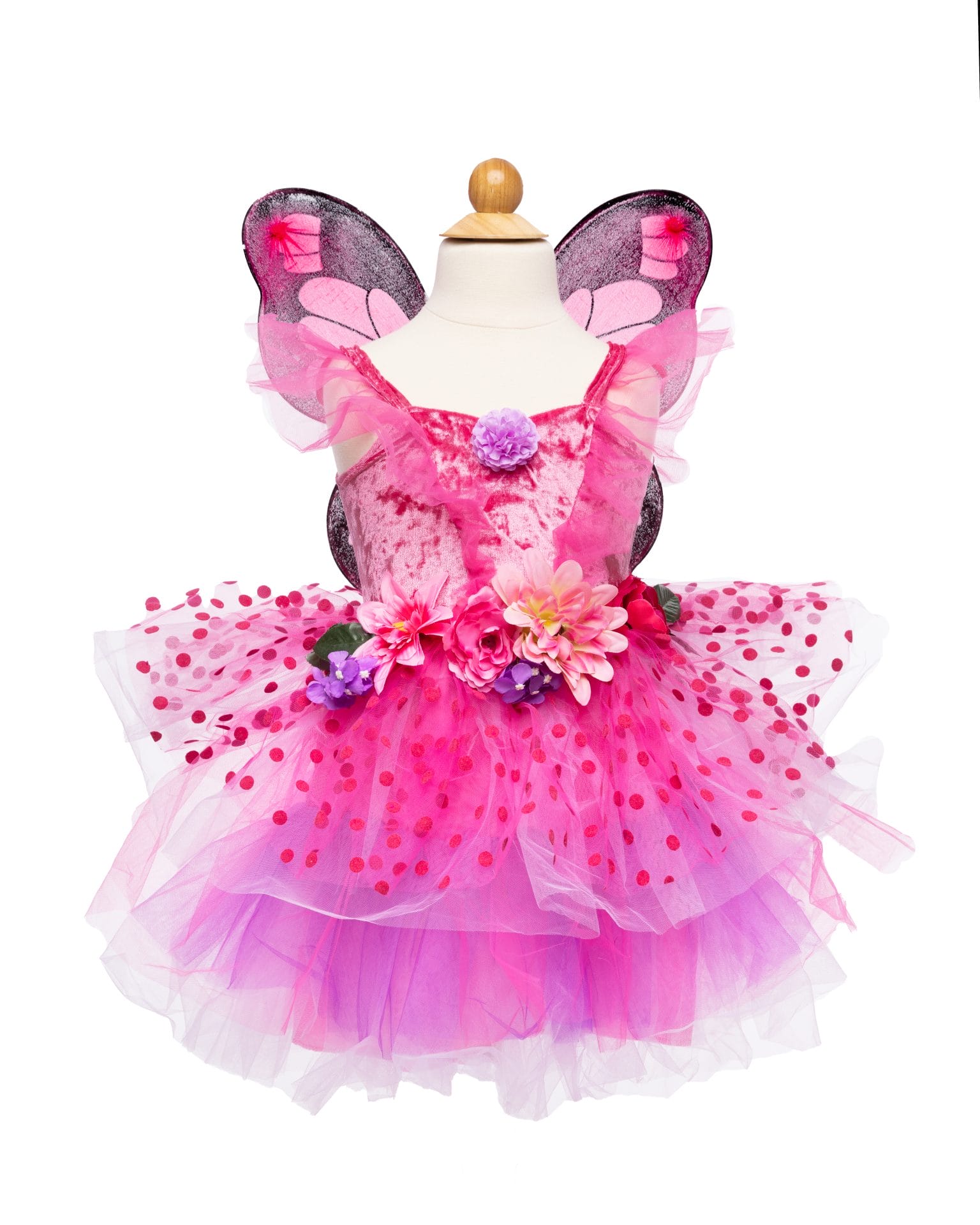 Roze elfjes jurken met vleugels, bloemen in de taille en een meerlaagse tule rok met stippen op een paspop