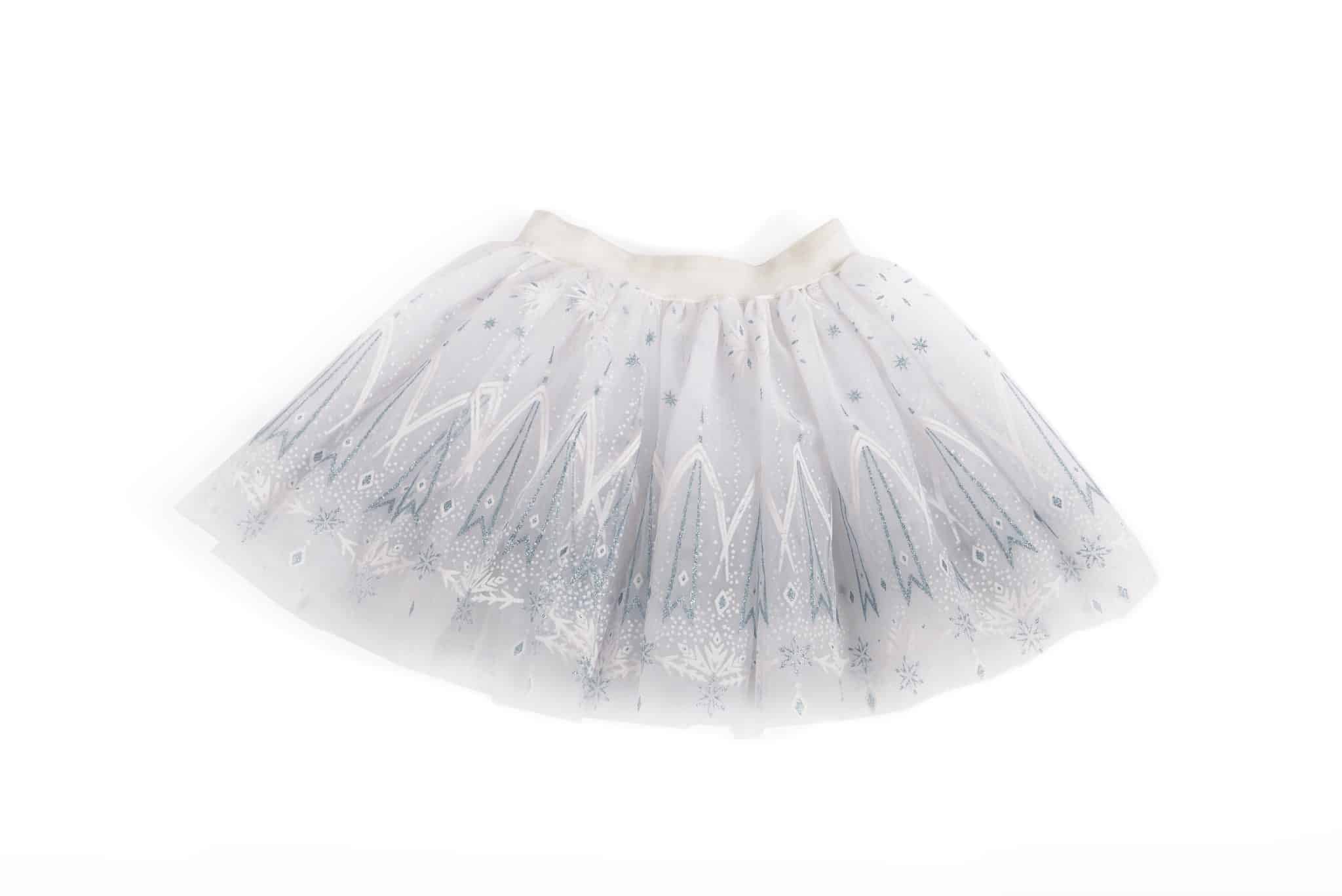 Witte tutu rok van Great Pretenders met zilveren sterren, sneeuwvlokken en glinsterende tule op een witte achtergrond