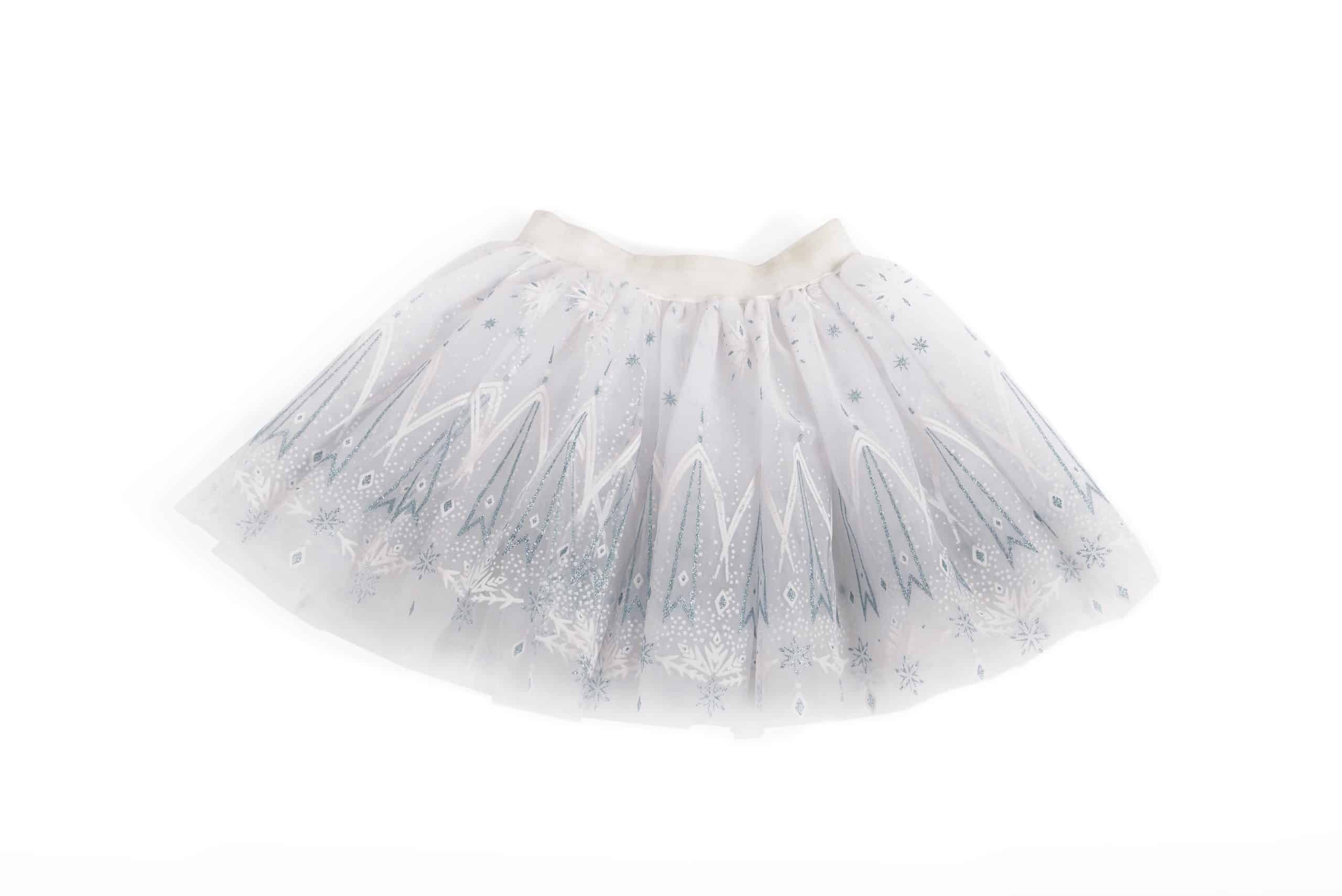 Witte tutu rok van Great Pretenders met zilveren sterren, sneeuwvlokken en glinsterende tule op een witte achtergrond